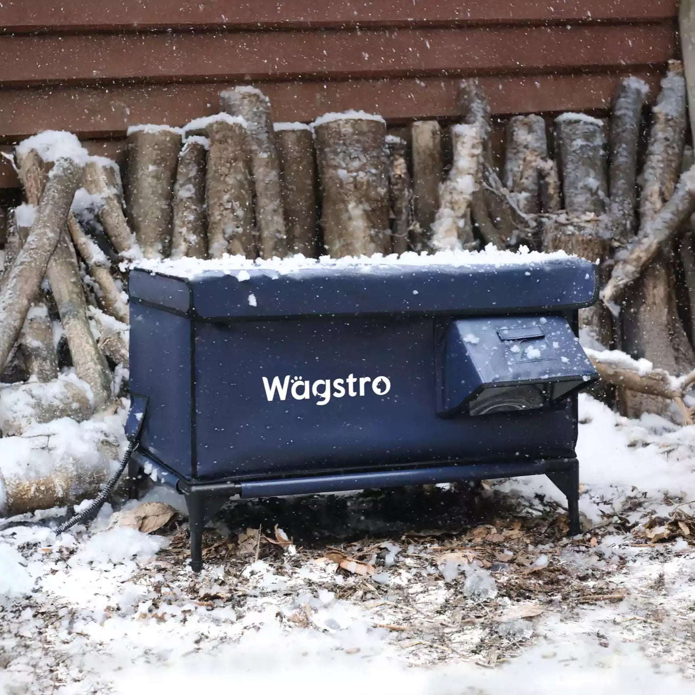 Wagstro heated outdoor cat shelter in snowy weather, keeping cats warm and dry in winter